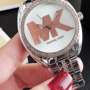 woman's rose gold  and silver watch